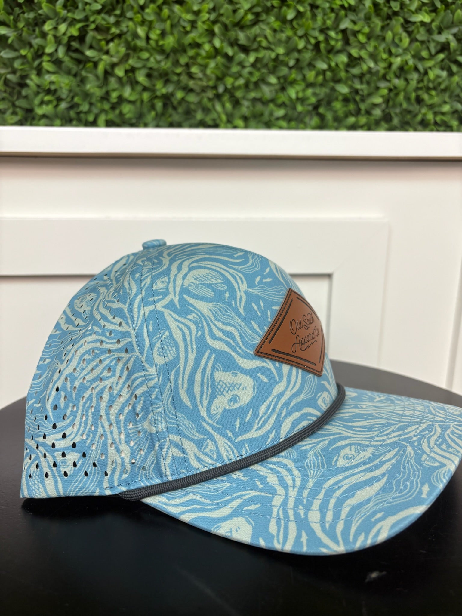 BENEATH THE TIDE LEATHER TRUCKER HAT - CAROLINA BLUE