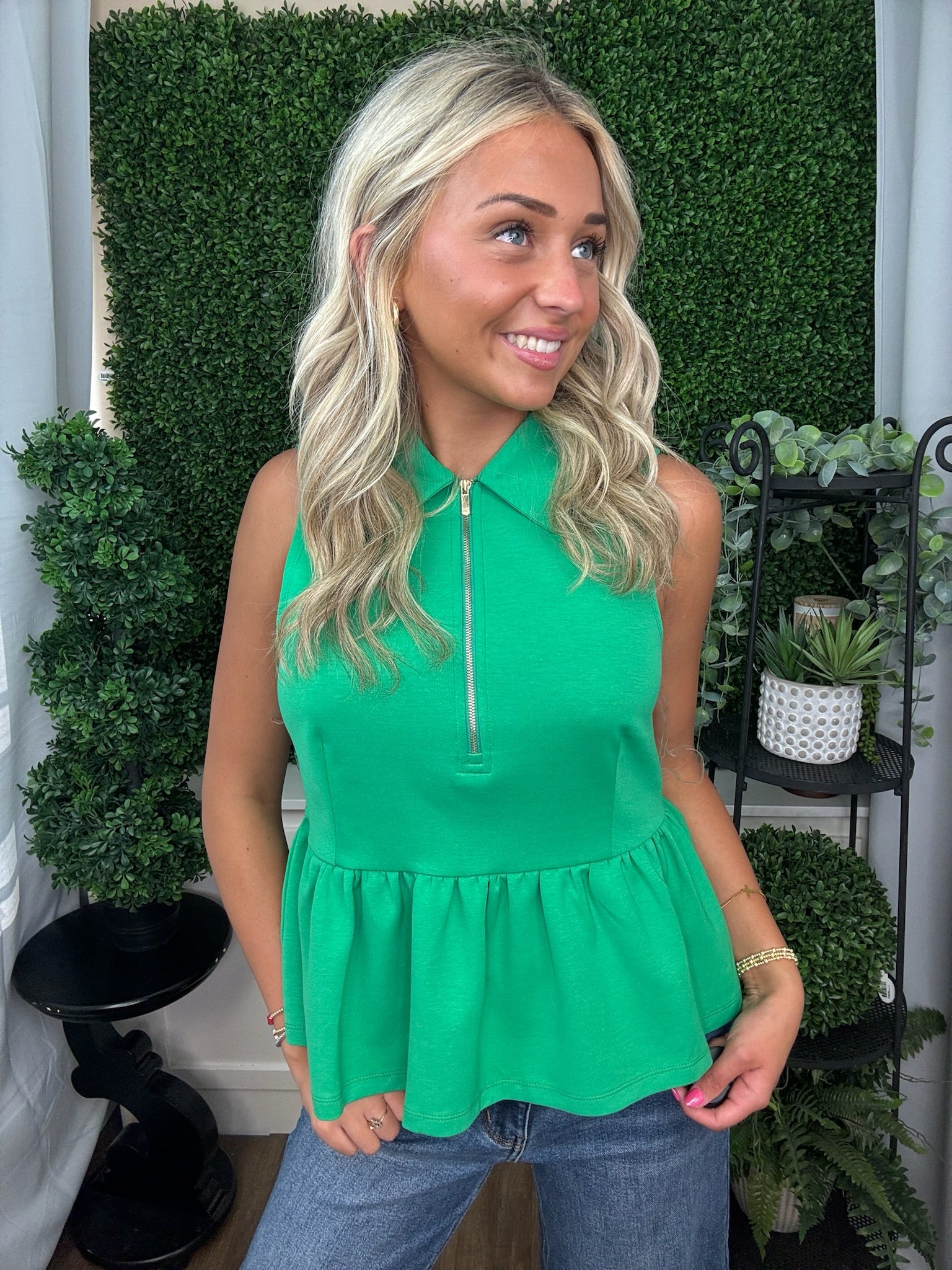 Green Sleeveless Zip Neck Peplum Top
