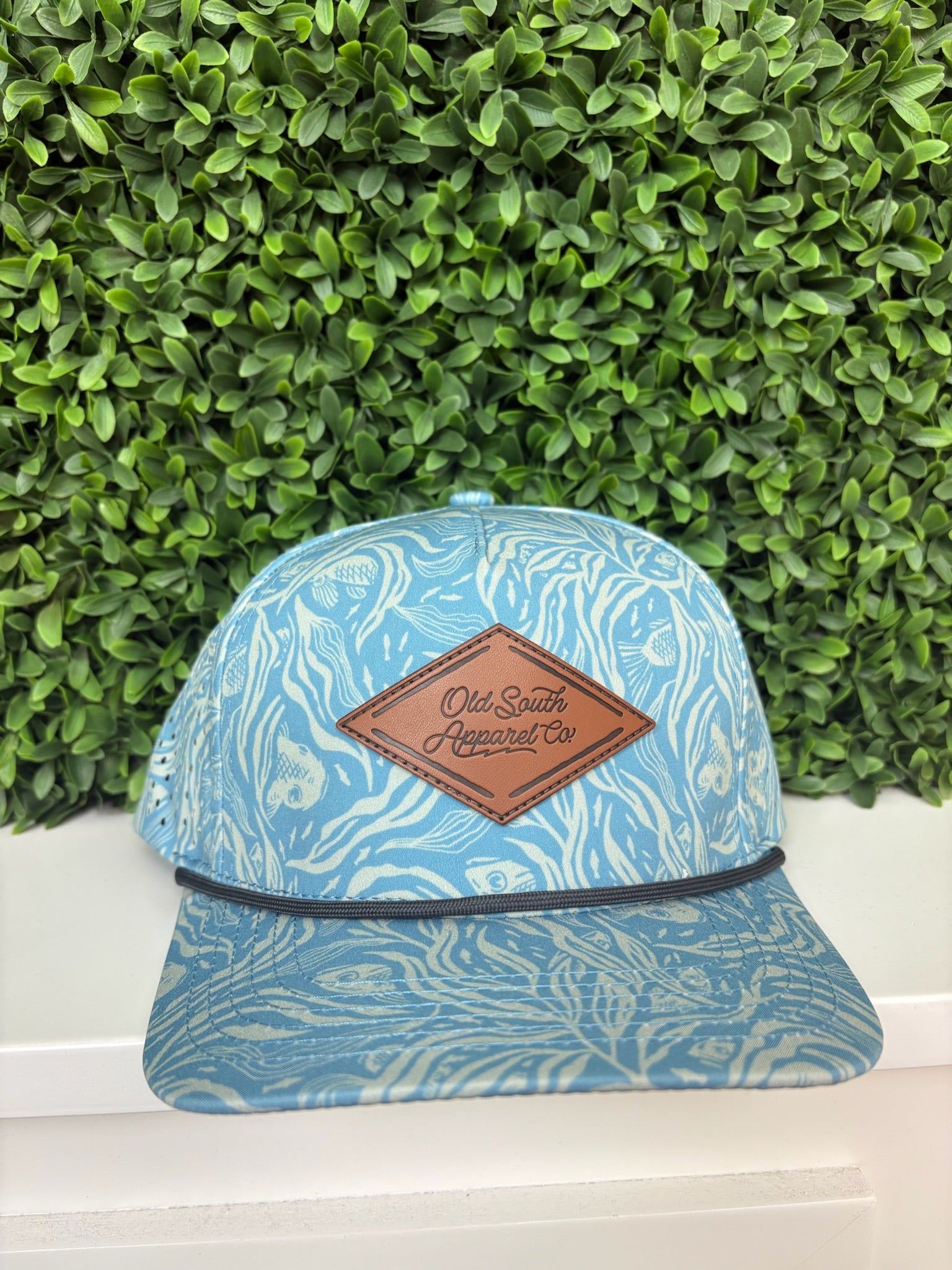 BENEATH THE TIDE LEATHER TRUCKER HAT - CAROLINA BLUE