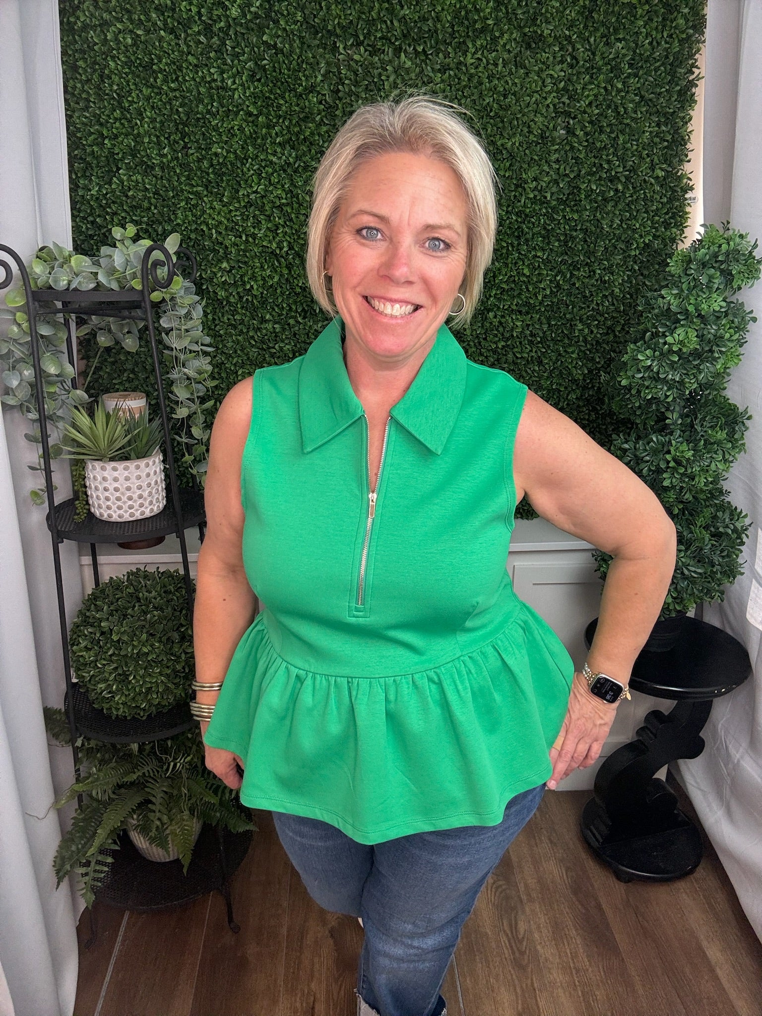 Green Sleeveless Zip Neck Peplum Top