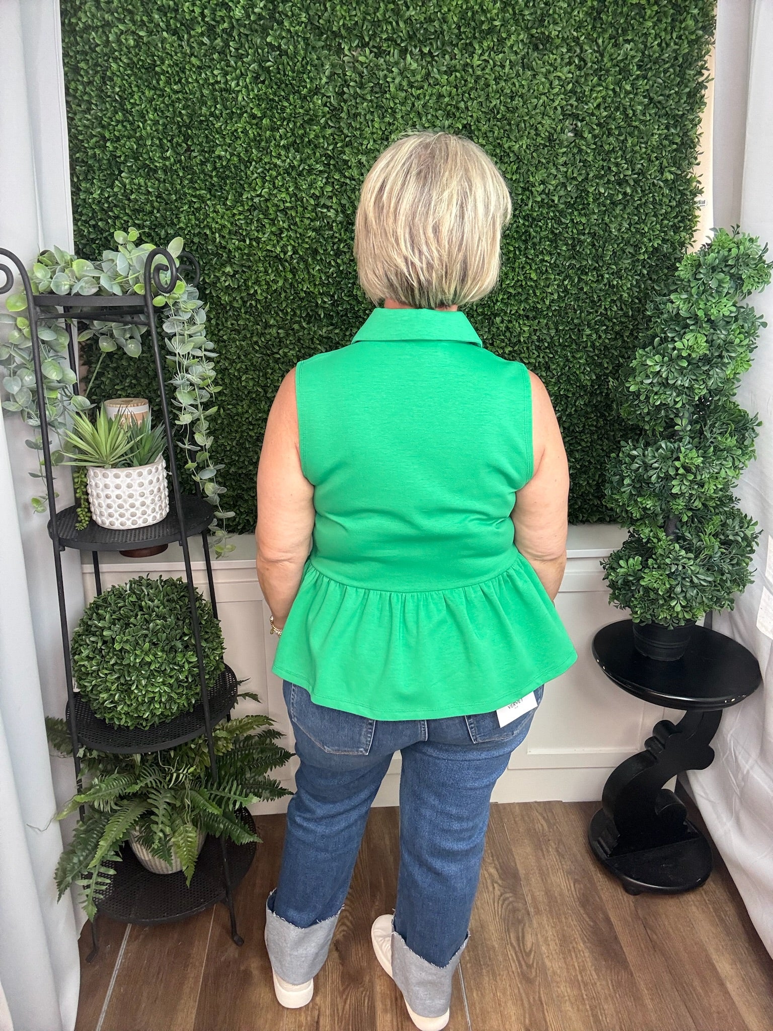 Green Sleeveless Zip Neck Peplum Top