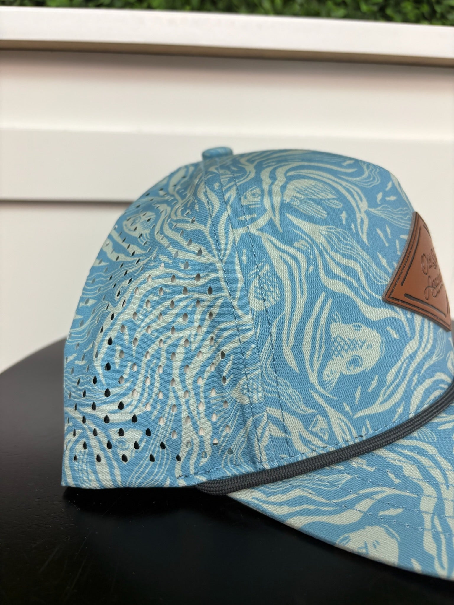 BENEATH THE TIDE LEATHER TRUCKER HAT - CAROLINA BLUE