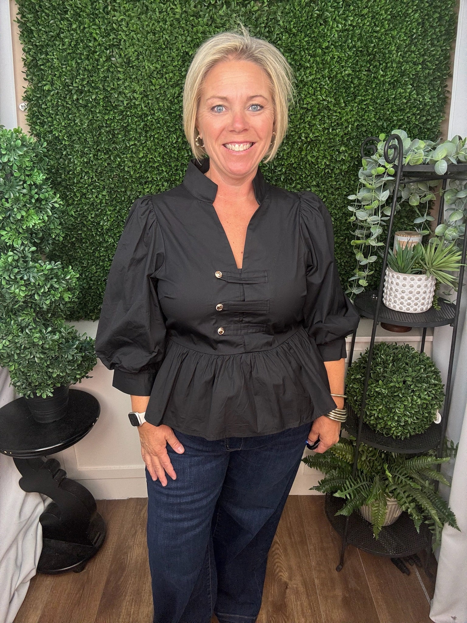 COLLARED TOP WITH BUTTON TAB DETAIL AND PEPLUM HEM - BLACK