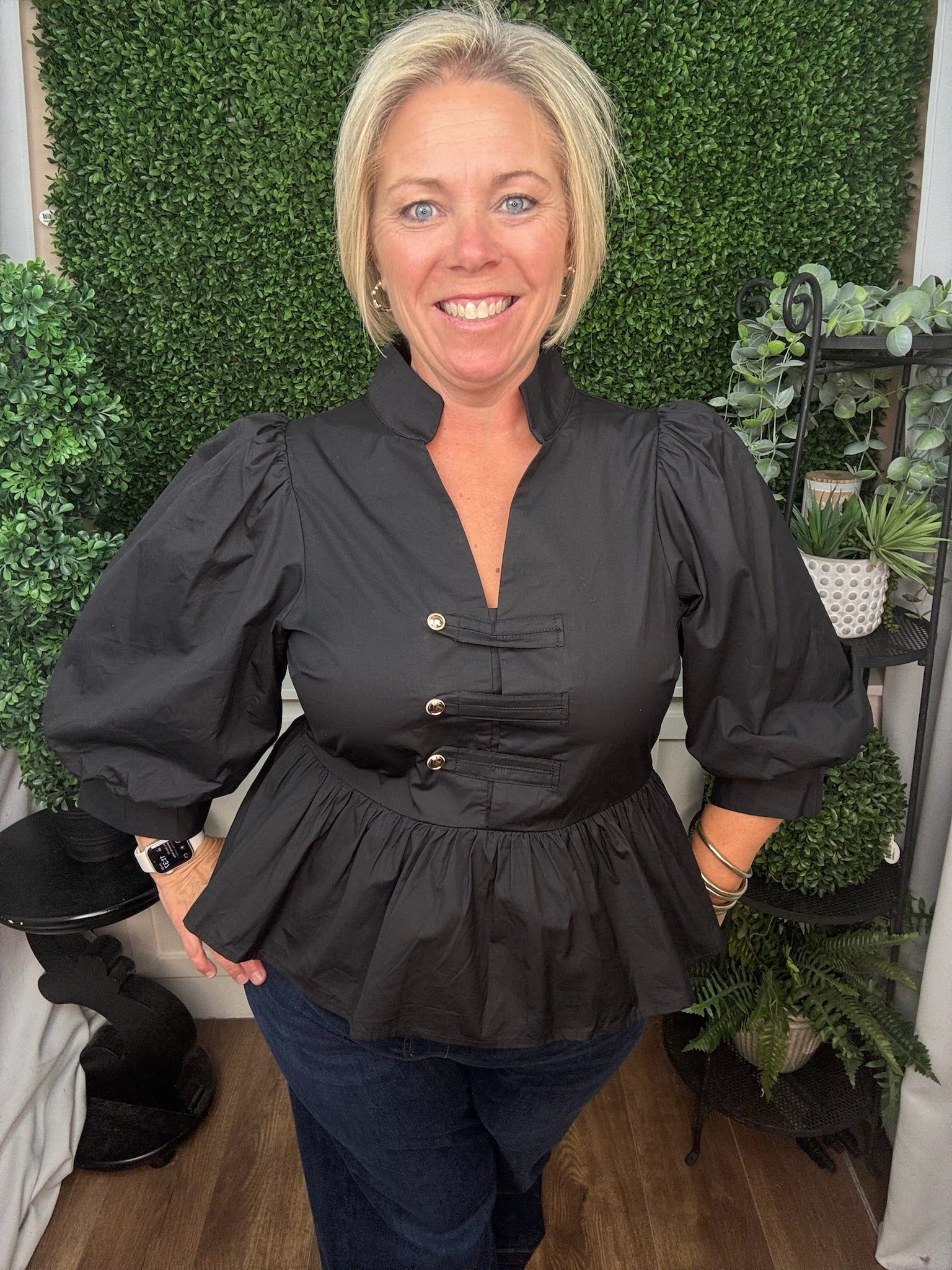 COLLARED TOP WITH BUTTON TAB DETAIL AND PEPLUM HEM - BLACK
